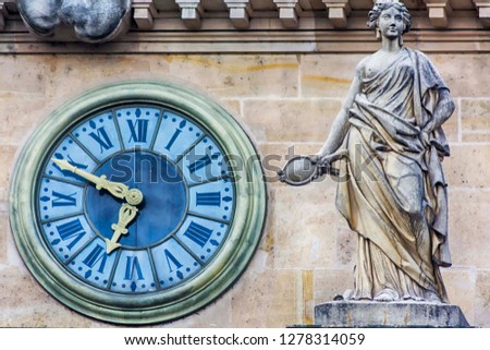 Clock of the 19th century on the facade of the building. Palace of Justice. Paris. France