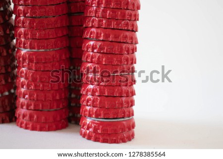 Red bottle caps on a white background