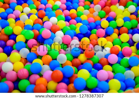 Lot of plastic and colored balls in a children ball pit