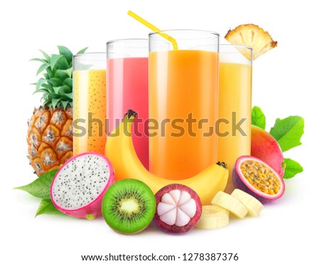 Isolated juices. Glasses of fresh juice and pile of tropical fruits isolated on white background with clipping path