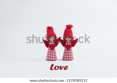 two little Angels with a red heart. Holiday of love. Valentine's day.