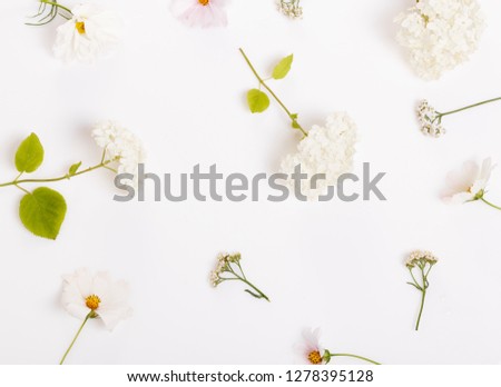 Festive wild spring summer flowers composition on the white background. Overhead top view, flat lay. Copy space. Birthday, Mother's, Valentines, Women's, Wedding Day concept.