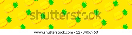 Creative summer pattern bright sweet tropical pineapple of paper on yellow background Flat lay top view copy space. Minimalistic food concept, origami paper fruit. Pineapple background