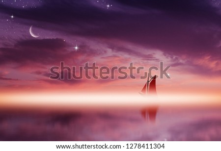 Amazing sunset picture with fluffy clouds, crescent moon and silhouette of yacht against bright rays of sun reflected on the water surface.