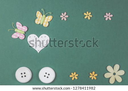 Background with decorative objects, butterfly, flowers and buttons.