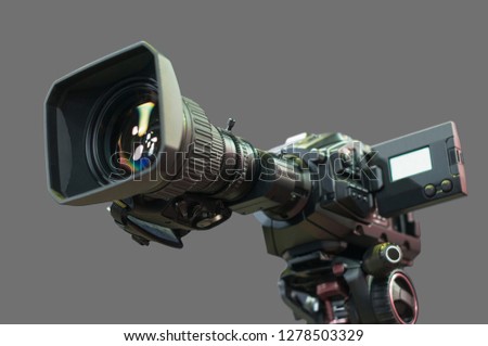 Professional video camera with large zoom isolated. TV and cinema camcorder on tripod. Television studio equipment, broadcast high technology. Modern digital media service. LIVE News interview