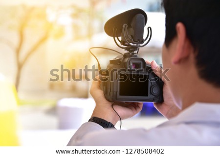 Man shooting VDO by camera DSLR
