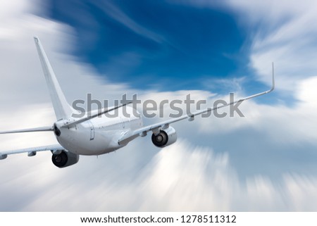 White airplane flying above cloud at daytime