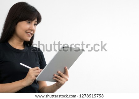Woman holding new version digital tablet device in hands with smart pencil. Tablet and digital pen connecting wifi. Experienced entrepreneur writing some text on tablet. Copy space. - Image. 