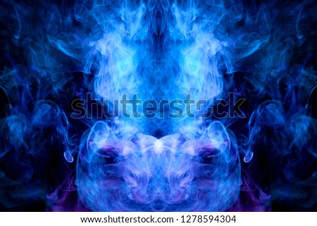 Thick colorful smoke of blue and purple  in the form of a skull, monster, dragon on a black isolated background. Background from the smoke of vape. Mocap for cool t-shirts

