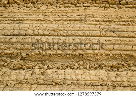 the texture of the sand from the sand career with different traces