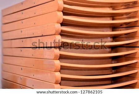 Wooden chairs piled up
