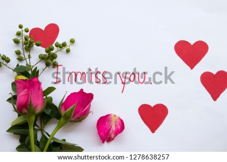 i miss you message card handwriting with pink rose flowers and draw red heart for special in valentine day on paper white 