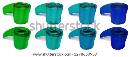 Blue and green atlas satin ribbon bobbin roll isolated on white background
