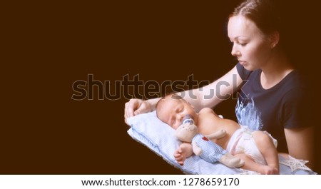 Mother and child. Handsome weekly boy is sleeping. Newborn baby photo ideas, baby photography,