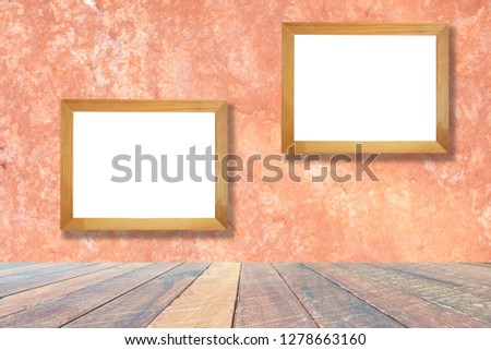 Orange wall and empty wood desk and Wooden frame .Blank space for text and images.