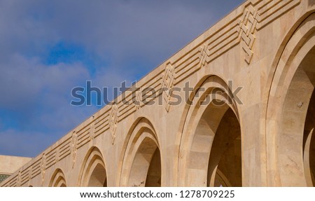 Archways from mosque Hassan 2 Casablanca Morocco. The Hassan II Mosque is a mosque in Casablanca, Morocco. It is the largest mosque in Africa, and the 5th largest in the world. 