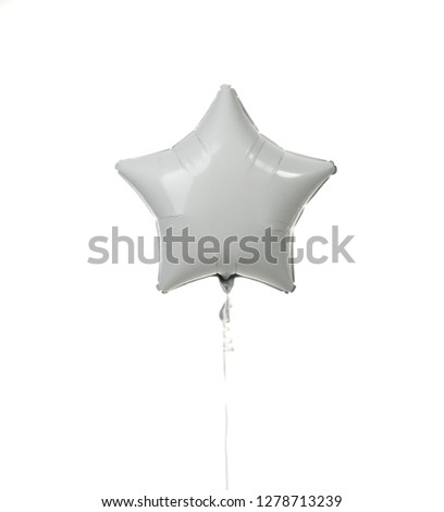 Image of single big white star latex balloon for birthday or wedding party isolated on a white background