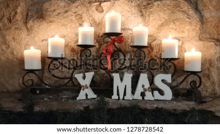 Candle lights with X Mas text