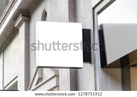 Store brand sign mockup in street on marble wall