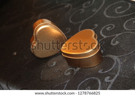 Two heart shaped decorative cake boxes at a wedding venue