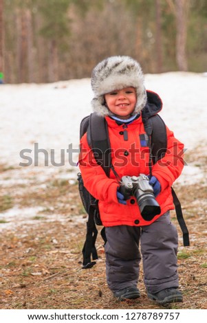 Little boy on a photo shoot in the winter park