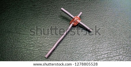 Cross symbol by brown cable power vintage style.
