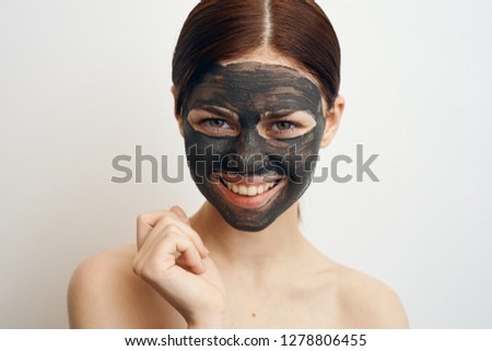 young woman in a cosmetic mask portrait
