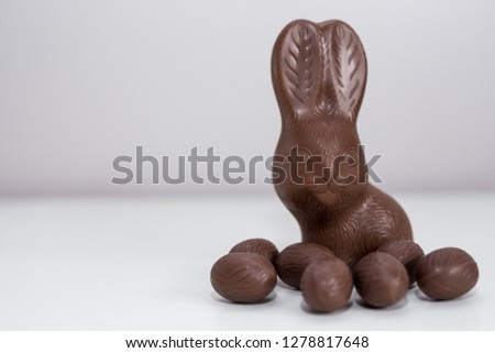 Easter concept - close up of chocolate bunny and sweets with copy space