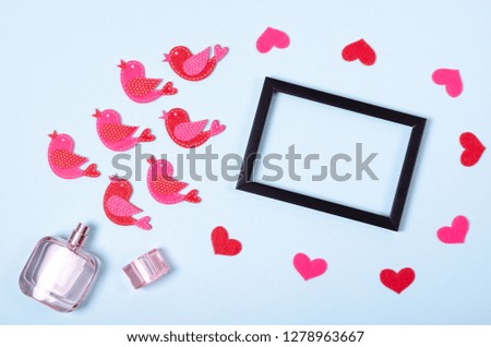Flat lay arrangement of hearts and perfume bottle for mock up design, table top view image of decoration valentine's day background