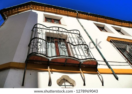 Colorful and majestic old house facade in Cordoba village, Cordoba province, Spain