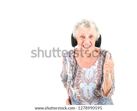 Confident old woman doing a thumb up gesture with her hand against a white background