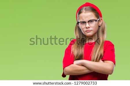 Young beautiful girl wearing glasses over isolated background skeptic and nervous, disapproving expression on face with crossed arms. Negative person.