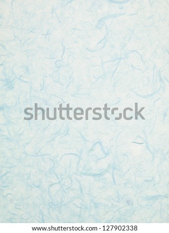 A close-up portrait of a seamless blue wallpaper background