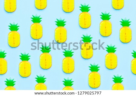 Creative summer pattern bright sweet tropical pineapple of paper on blue background Flat lay top view copy space. Minimalistic food concept, origami paper fruit. Pineapple background
