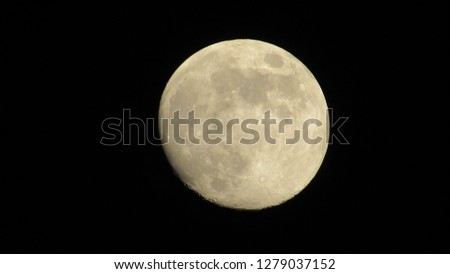 Full moon in the night sky. Moon on the black background