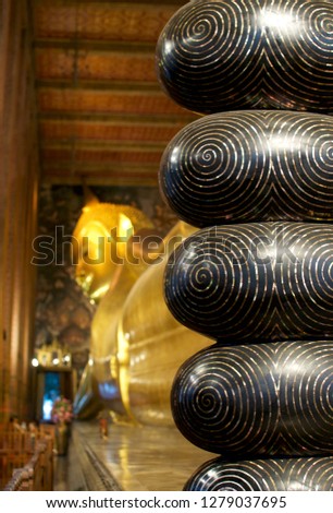 Close up picture picture of the huge feet of the reclining Buddha at the Wat Pho in Bangkok, Thailand