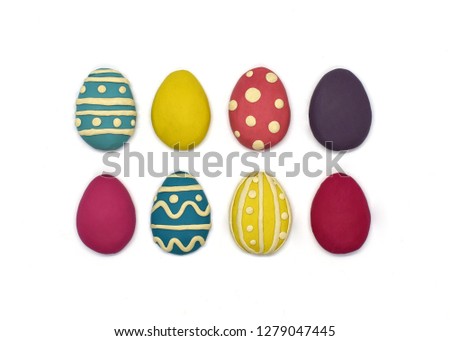 Set of eight plasticine easter eggs on a white background