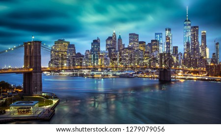 a magnificent view of the lower Manhattan and Brooklyn Bridge