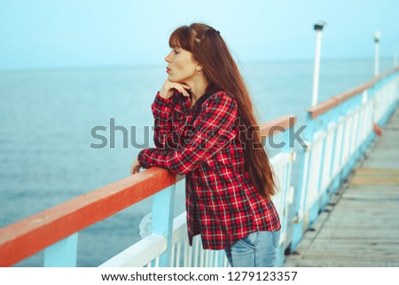 girl standing on the pier
