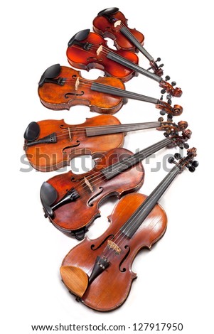 different sized violins on white background