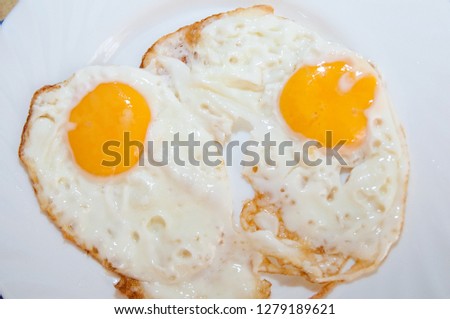 scrambled eggs from two eggs on a white background
