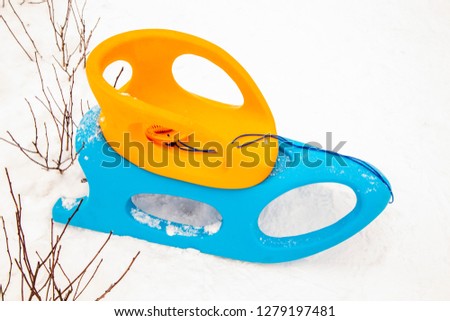 yellow-blue sled in the snow, winter