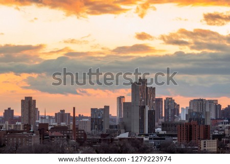 A Vibrant Spring Sunset Behind Minneapolis Apartment Buildings and High Rises