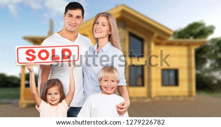 Happy Family with for sale sign isolated on white background