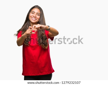 Young beautiful arab woman over isolated background smiling in love showing heart symbol and shape with hands. Romantic concept.