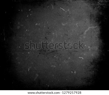 Black grunge scratched scary background, dusty horror texture, old film effect