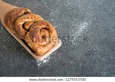 traditional Dutch cinnamon, sugar bread in a roll, called Zeeuwse Bolus Royalty-Free Stock Photo #1279353700