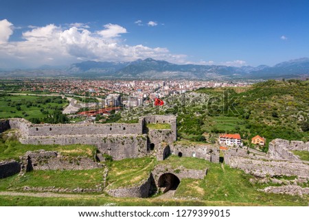 Albanian flag in Rozafa Castle with Shkoder, Albania in the background