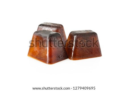 Ice cubes made with coffee on white background